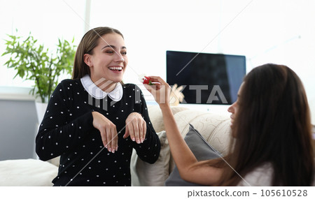 Smiling female in rabbit pose Smiling female in rabbit pose 105610528