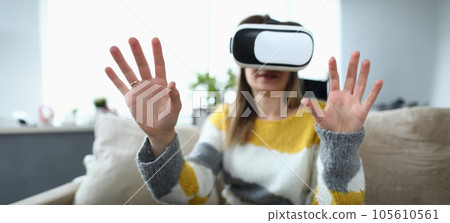 Close-up view of happy young woman using virtual reality headset Close-up view of happy young woman using virtual reality headset 105610561