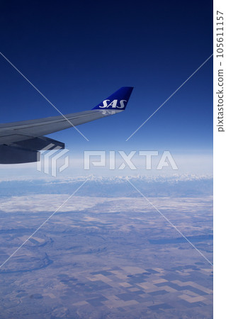 KOPENHAGEN, DENMARK - 24 NOV 2018: View from the aircraft cabin to the wing shortly after take-off 105611157