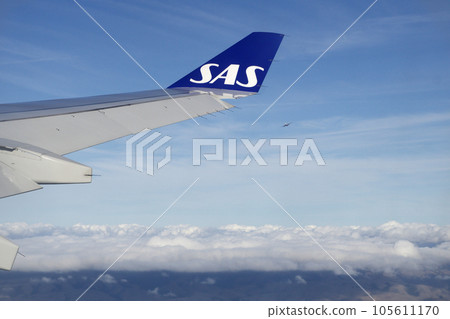 KOPENHAGEN, DENMARK - 24 NOV 2018: View from the aircraft cabin to the wing shortly after take-off KOPENHAGEN, DENMARK - 24 NOV 2018: View from the aircraft cabin to the wing shortly after take-off 105611170