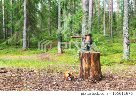 Brewing coffee on camping stove 105611676