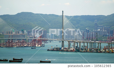 Kwai Tsing container terminal port view in drone, and hong kong skyline and stonecutter's bridge 105612365