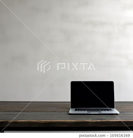 Laptop computer on wooden table with concrete wall background, stock photo 105616169