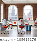 Interior of a modern office with red and orange chairs and computers 105616176