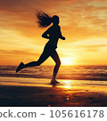 Young woman running on the beach at sunset - healthy lifestyle concept 105616178