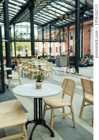 Cafe interior design. Interior design style, wooden tables and chairs 105616213