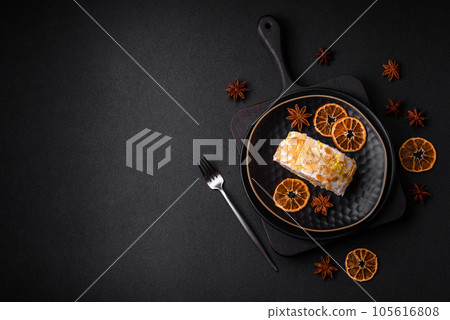 Delicious, fresh, sweet meringue roll with cream, almond chips, nuts and berries 105616808