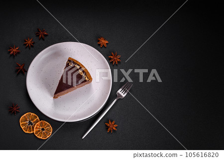 Delicious, fresh, sweet chocolate cake with nuts cut into slices Delicious, fresh, sweet chocolate cake with nuts cut into slices 105616820