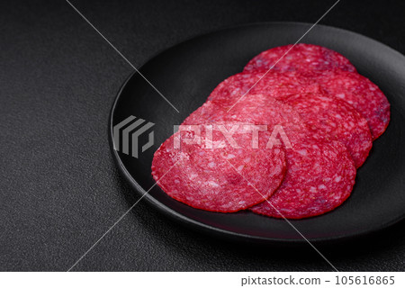 Delicious smoked salami sausage with salt, spices and herbs Delicious smoked salami sausage with salt, spices and herbs 105616865