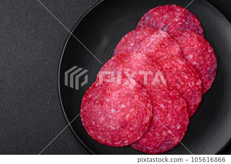 Delicious smoked salami sausage with salt, spices and herbs Delicious smoked salami sausage with salt, spices and herbs 105616866