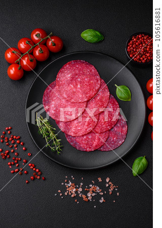 Delicious smoked salami sausage with salt, spices and herbs Delicious smoked salami sausage with salt, spices and herbs 105616881