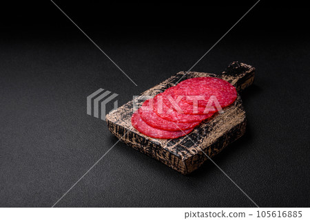 Delicious smoked salami sausage with salt, spices and herbs 105616885