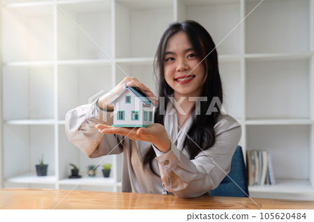 Property insurance, real estate broker or home insurance agent gesture protect house, contract document, security concept, protection. Insurance rent buy sell mortgage 105620484