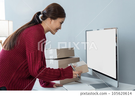 Young happy Asian woman looking at laptop screen, celebrate for sell, smile young woman entrepreneur happy for sale successful Young happy Asian woman looking at laptop screen, celebrate for sell, smile young woman entrepreneur happy for sale successful 105620614