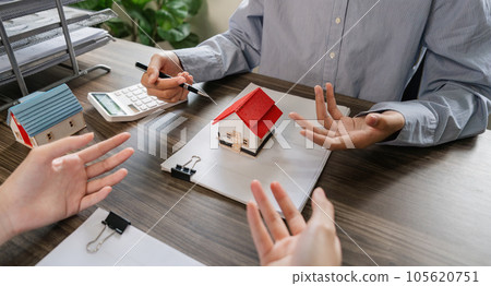 Real estate agent to his discussion and consult about house contracts client after signing contract, concept for real estate, moving home or renting property 105620751