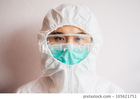 Portrait of healthcare worker wearing PPE suit for working in hospital during covid-19 pandemic. Portrait of healthcare worker wearing PPE suit for working in hospital during covid-19 pandemic. 105621751