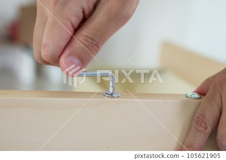 Assembly wooden furniture at home using screw allen 105621905