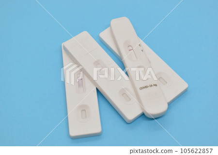 covid test kit on blue background covid test kit on blue background 105622857
