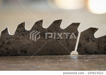 sharp metal saw on wood plank texture background, construction machine sharp metal saw on wood plank texture background, construction machine 105623022