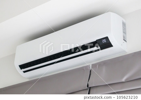 Air conditioner on white wall room interior background 105623210