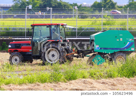 Straw roll work by tractor Straw roll work by tractor 105623496