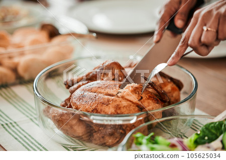Hands, cutting turkey and thanksgiving in closeup, lunch or food for event, celebration and nutrition. Person, cutlery and chicken food for eating, share and culture for diet, zoom or dinner in home Hands, cutting turkey and thanksgiving in closeup, lunch or food for event, celebration and nutrition. Person, cutlery and chicken food for eating, share and culture for diet, zoom or dinner in home 105625034