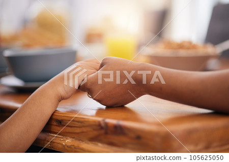Holding hands, prayer and dinner table with gratitude at family lunch with food and worship. Thanksgiving, holiday and dining room of people together at home for religion in a house with care to pray Holding hands, prayer and dinner table with gratitude at family lunch with food and worship. Thanksgiving, holiday and dining room of people together at home for religion in a house with care to pray 105625050