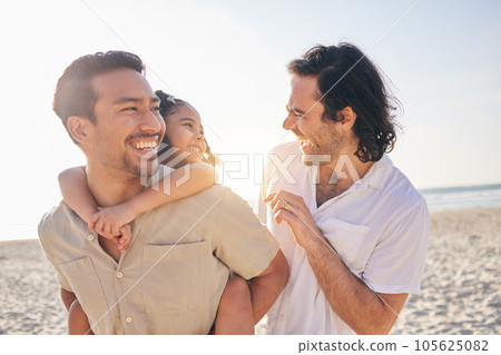 Happy, piggyback and lgbt family at the beach for love, care and a vacation in summer. Smile, nature and gay parents laughing with a child at the sea during a holiday for bonding, comedy or travel 105625082