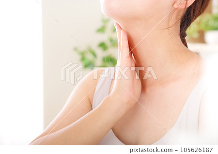 Young woman taking care of her neck Young woman taking care of her neck 105626187