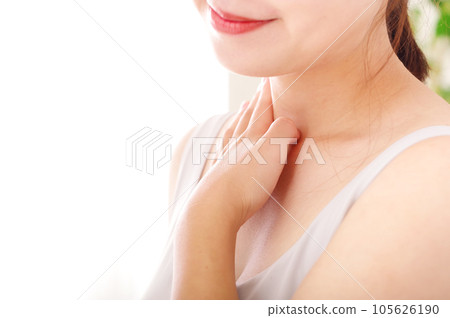 Young woman taking care of her neck Young woman taking care of her neck 105626190