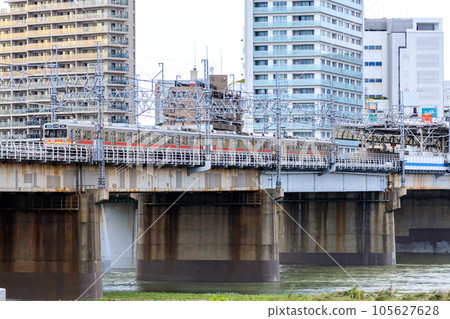 A Tokyu train crossing the Arakawa iron bridge near Futako-Tamagawa Station A Tokyu train crossing the Arakawa iron bridge near Futako-Tamagawa Station 105627628