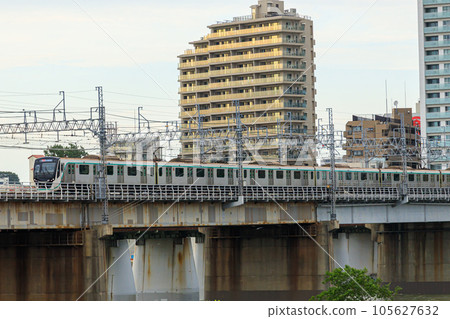 A Tokyu train crossing the Arakawa iron bridge near Futako-Tamagawa Station A Tokyu train crossing the Arakawa iron bridge near Futako-Tamagawa Station 105627632