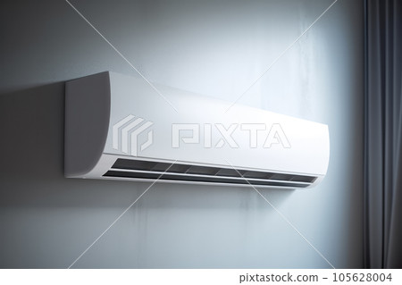 Cooling Innovation: Wall Mounted Air Conditioner in Interior Setting - Discover cooling innovation with this wall mounted air conditioner featured in a room environment. 105628004
