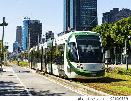 View of circular light rail train and the metropolitan building in Kaohsiung, Taiwan. The Circular Light Rail System in Kaohsiung is the first in Taiwan. 105630189