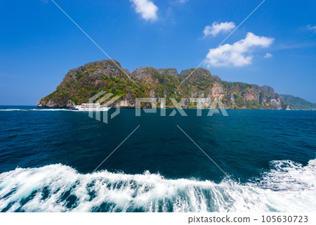 Ferry ship boat with  trail wave splash on turquoise sea, Koh Phi Phi island, Thailand 105630723