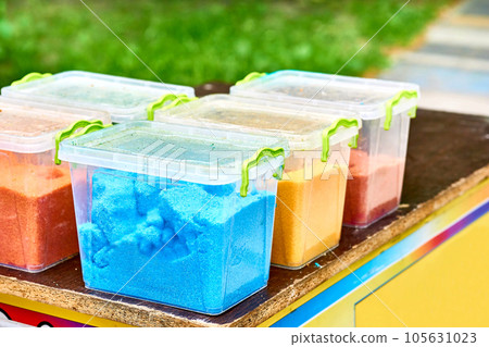 Multi colored food fillers for popcorn with a variety of flavors in plastic box Multi colored food fillers for popcorn with a variety of flavors in plastic box 105631023