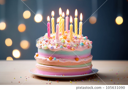 Colorful birthday cake with sprinkles and candles Colorful birthday cake with sprinkles and candles 105631090