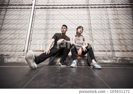young asian adult man and woman resting after exercise with cool attitude 105631172