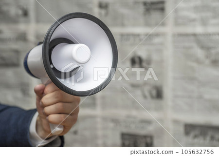 A man holding a megaphone on background of newspapers. News message concept A man holding a megaphone on background of newspapers. News message concept 105632756