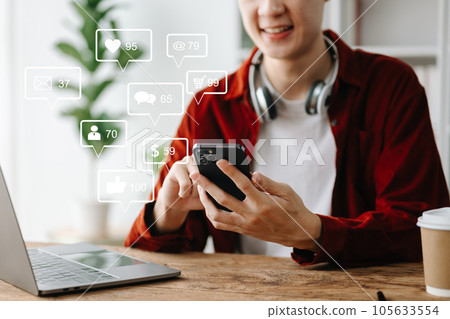 Social media and Marketing virtual icons screen concept. close up of businessman typing keyboard tablet with laptop computer and smart phone in office 105633554