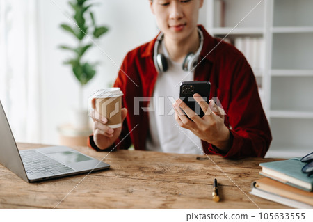 businessman hand using smart phone, tablet payments and holding credit card online shopping, omni channel, digital tablet docking keyboard computer 105633555