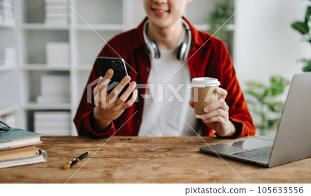 businessman hand using smart phone, tablet payments and holding credit card online shopping, omni channel, digital tablet docking keyboard computer 105633556