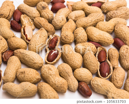 Bunch of ecological peanuts on a white background 105633703