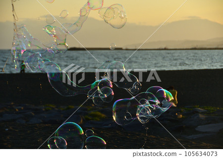 Sunset sky and soap bubbles Sunset sky and soap bubbles 105634073