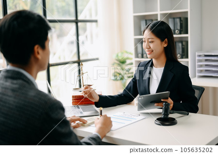 business people and lawyers discussing contract papers sitting at the table. Concepts of law, advice, legal services. in morning light 105635202