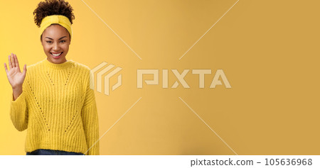 Cute timid friendly young girl wanna find new friends look pleasant smiling charmingly gladly waving hand hello hi gesture say welcome greeting heartwarming introduction herself, yellow background Cute timid friendly young girl wanna find new friends look pleasant smiling charmingly gladly waving hand hello hi gesture say welcome greeting heartwarming introduction herself, yellow background 105636968