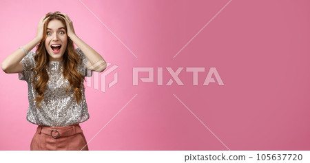 Excited happy surprised charming glamour young girl winning unexpectedly grab head amazed drop jaw smiling look camera astonished thrilled happiness, standing astonished pink background 105637720