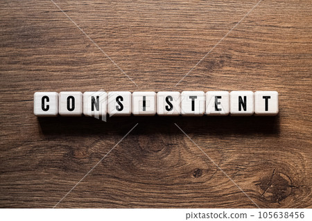 Consistent - word concept on building blocks, text 105638456