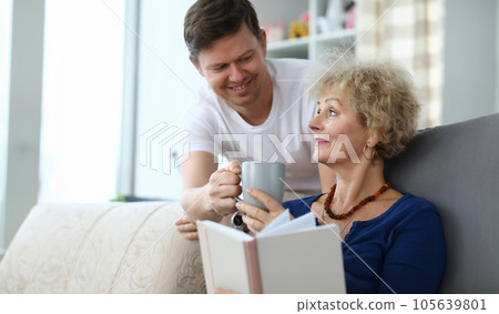 Son caring of aged mother Son caring of aged mother 105639801