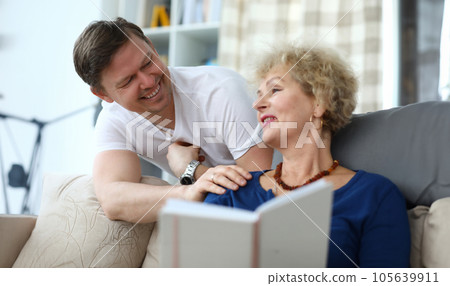 Portrait of happy cheerful relatives smiling at home. 105639911